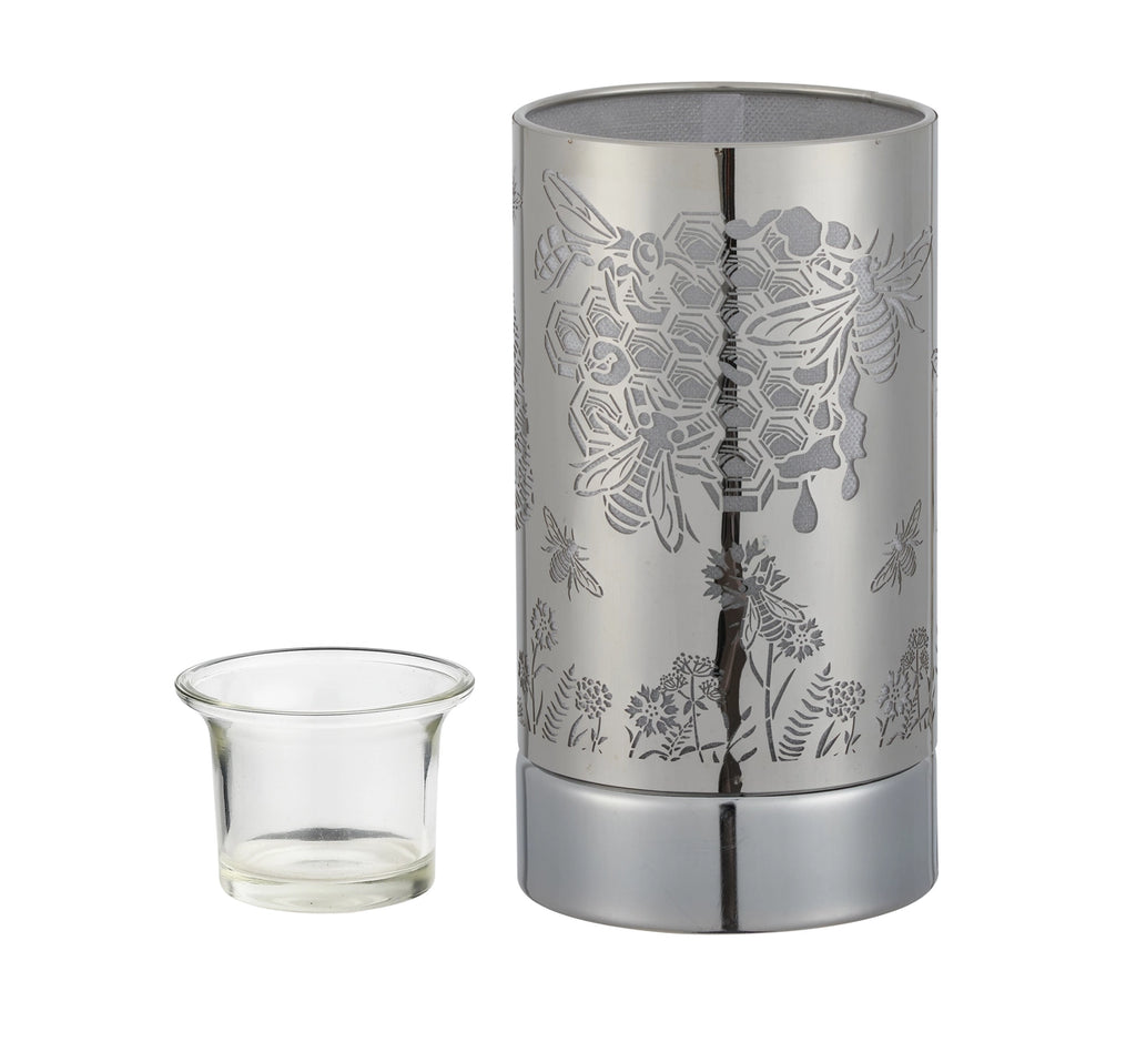 Silver floral-patterned lantern with a glass container on a white background