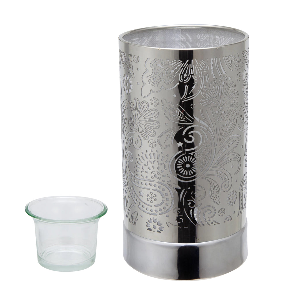 Silver patterned candle holder with a small clear container on a white background