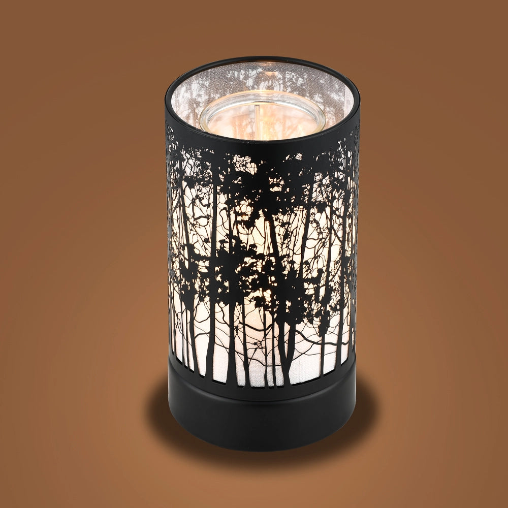 Decorative candle holder with forest design on a brown background