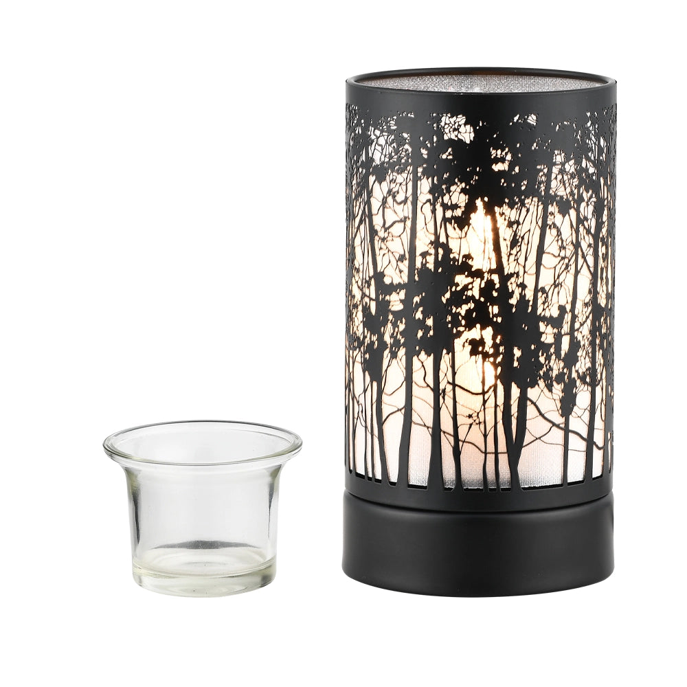 Decorative candle holder with forest design and a clear glass candle
